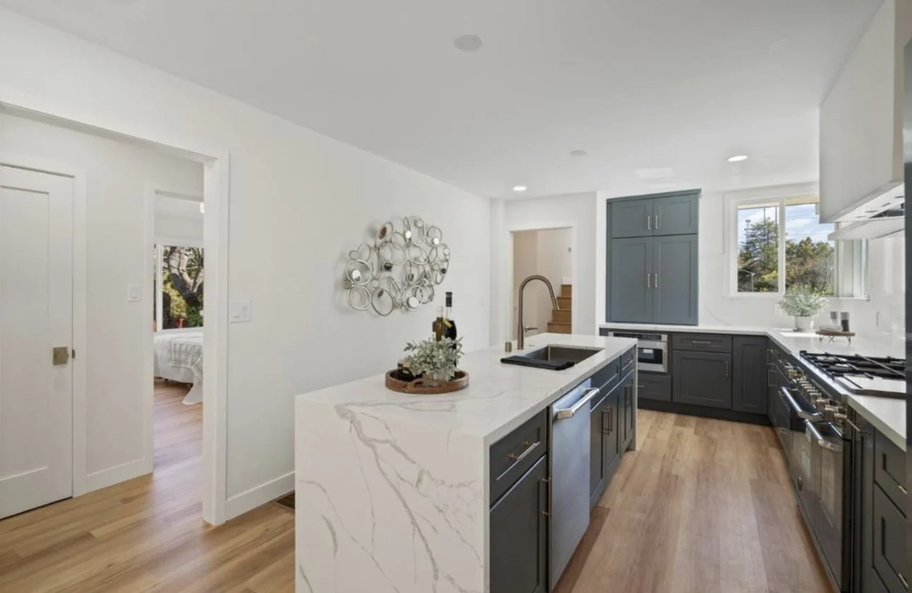 Open remodeled kitchen with a large island and thoughtful finishes